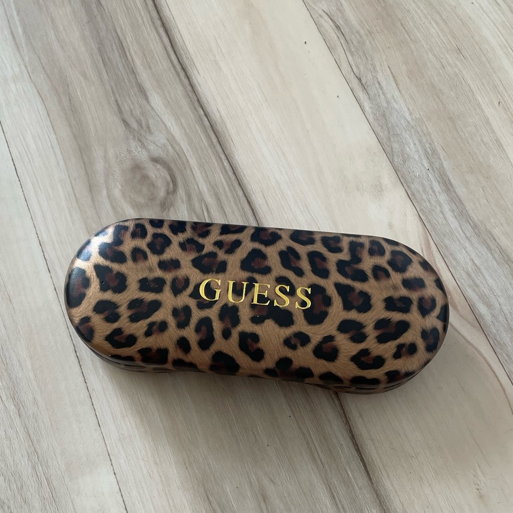 Guess animal print hard glass case.